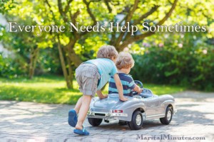 Two happy children playing with toy car